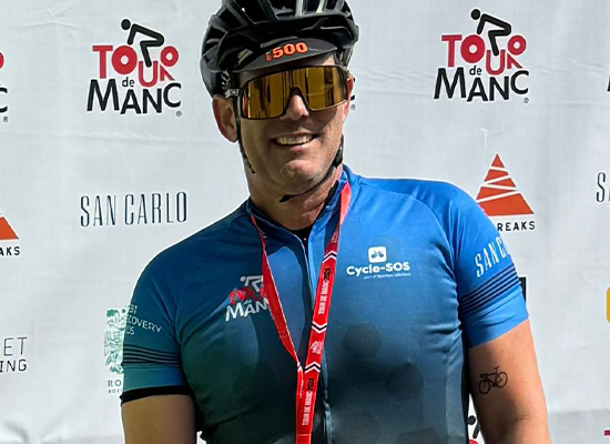 Tom Webb on bike for Tour de Manc